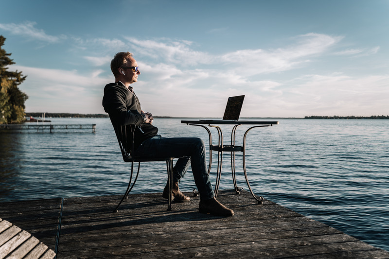 image of man on dock with computer