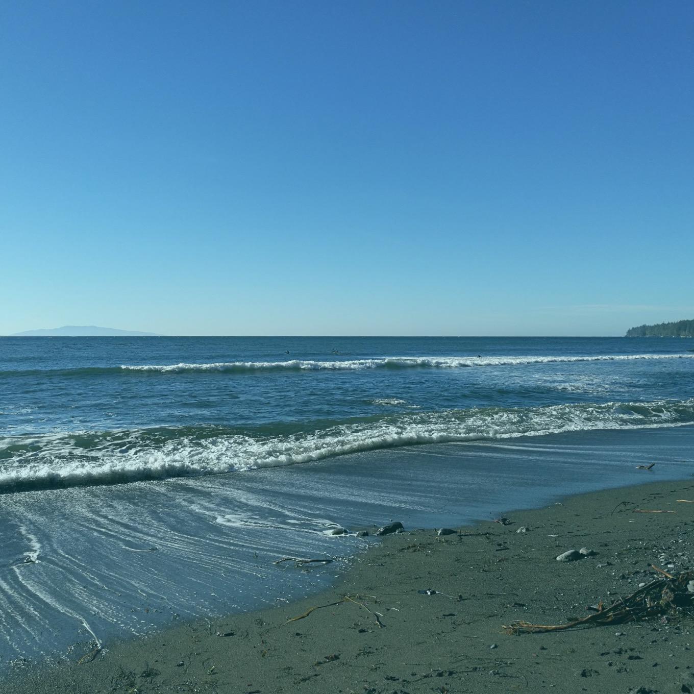 A daytime photo of a shoreline.