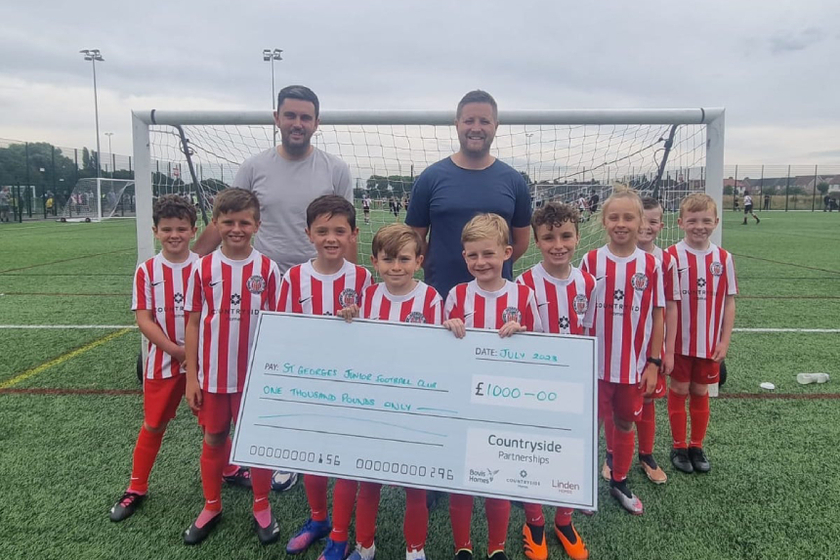 St George’s Eagles Under 9s team with team manager, Sean Powell and Countryside's Area Build Manager, Stuart Whittaker