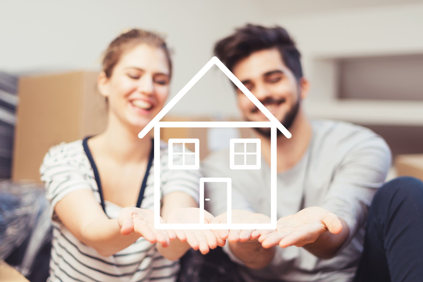 Couple with house in hand