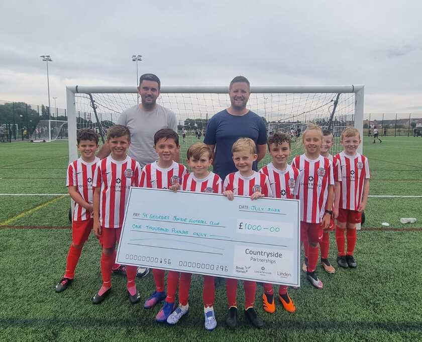 St George’s Eagles Under 9s team with team manager, Sean Powell and Countryside's Area Build Manager, Stuart Whittaker copy