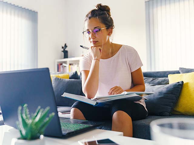 Woman sitting at a laptop computer