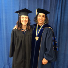 Image of two graduates