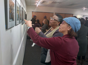 Image of individuals looking at artwork