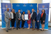 Left to right: Patrick Paul '94 (Anderson Center for Autism), Brittany Hoosier (AIM Services), Christopher Lyons (AIM Services), Noor Syed, Lauren Allen, Mayor Ron Kim, Acting Provost Nathan Gonyea, President Lisa Vollendorf