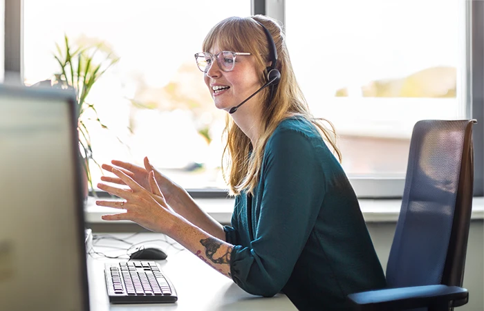 A woman working at her desk on a call
