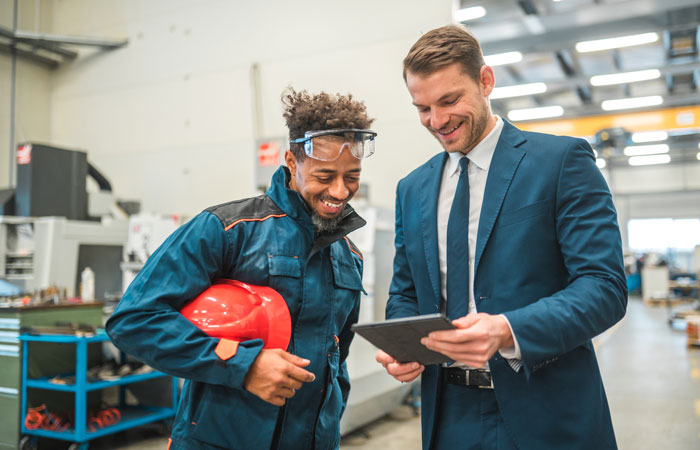 two people working in a factory