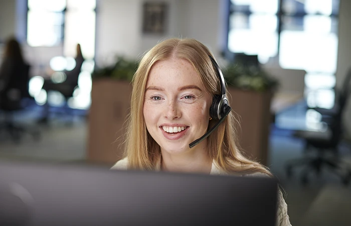 a customer support rep talking on the phone