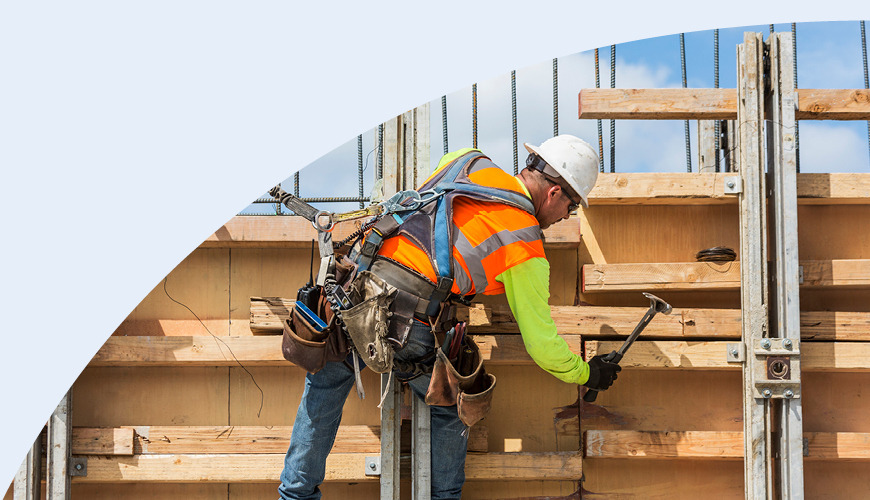 Construction worker hammering wood