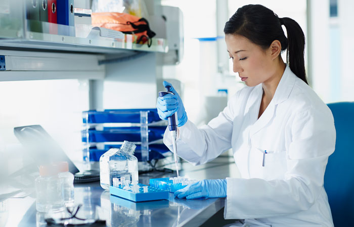 A woman in a lab running a test