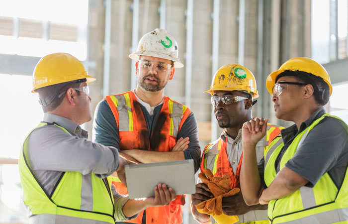 4 contractors having a conversation about the project