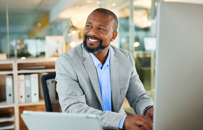 A man sitting at a computer working