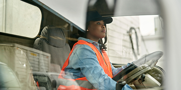 woman driving work truck
