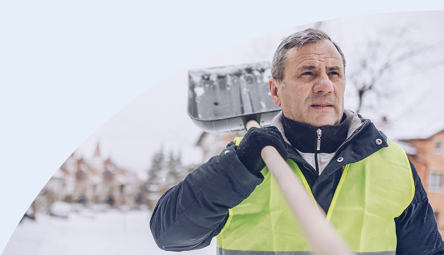 man holding snow shovel