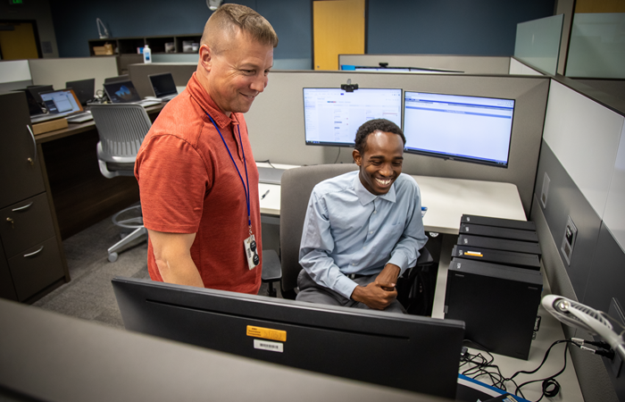 High school interns sitting in a workspace