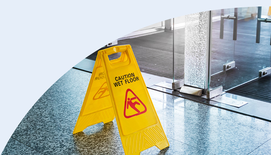 A caution wet floor sign in an office building 
