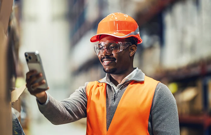 A person in a warehouse doing an inspection