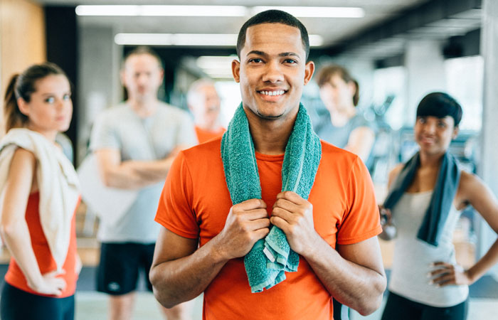 A man looking at the camera after a group workout