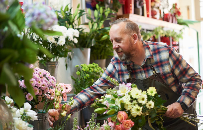 A florist working in a flower shop