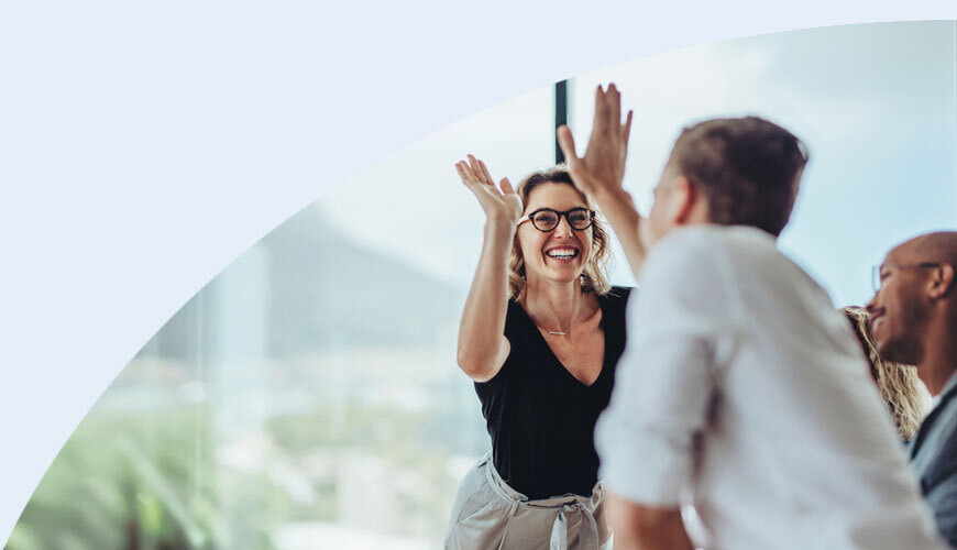 Colleagues giving high fives