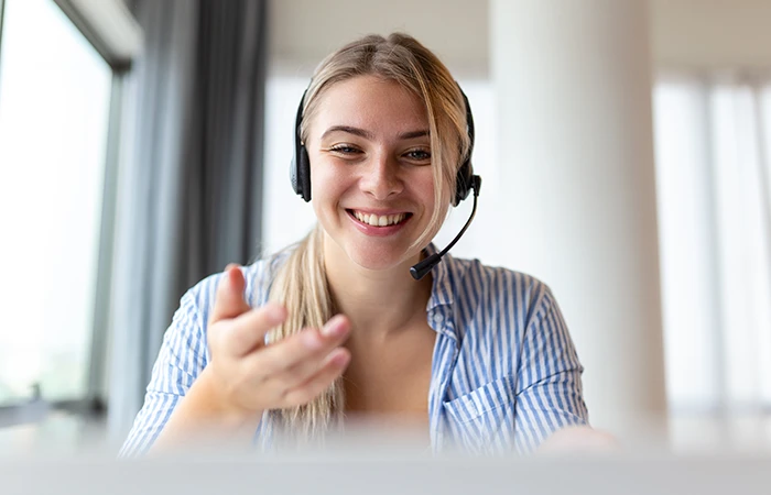 A person on with a headset on a call