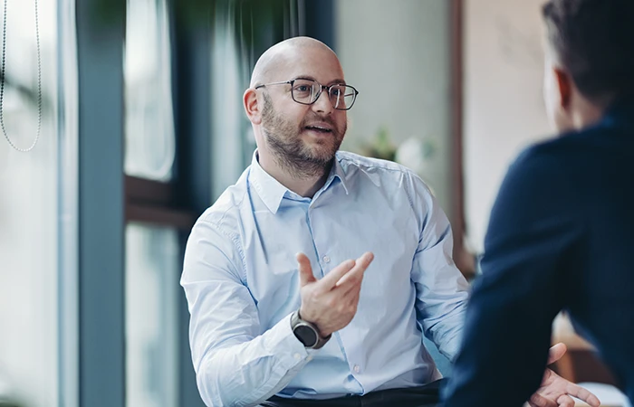 Two people talking in a meeting