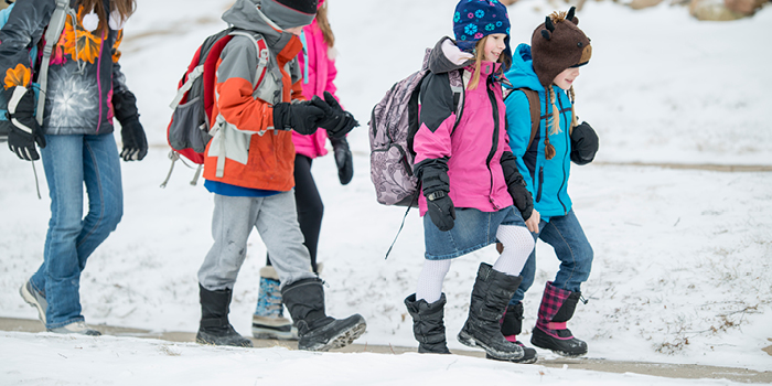 kids walking through snow to school