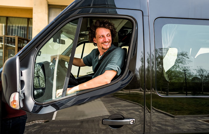 A driver in their work vehicle