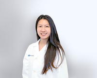 Zhuiyi Lin smiling in white coat
