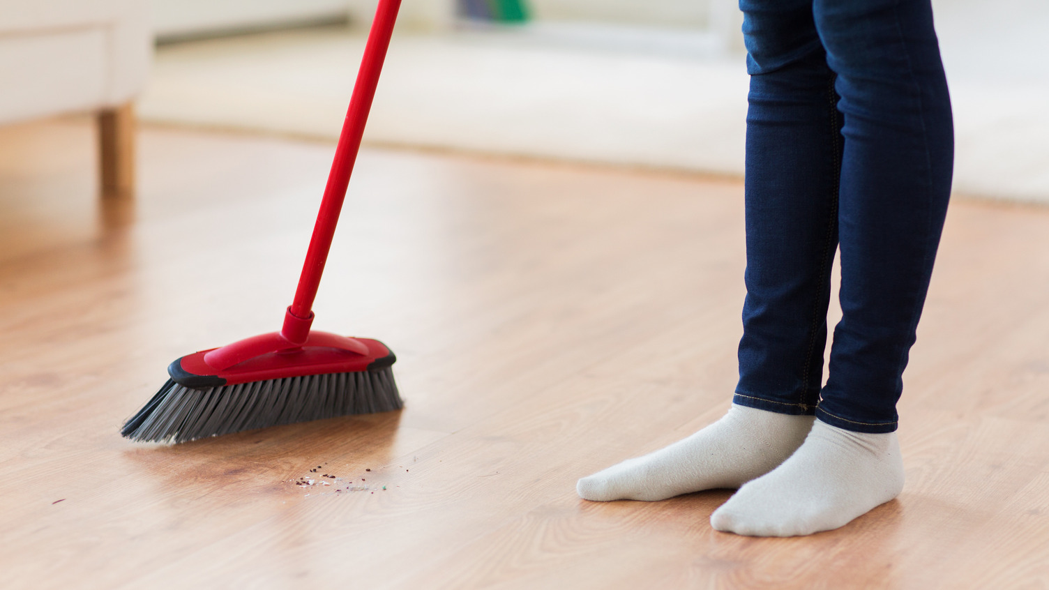 Person sweeping floor