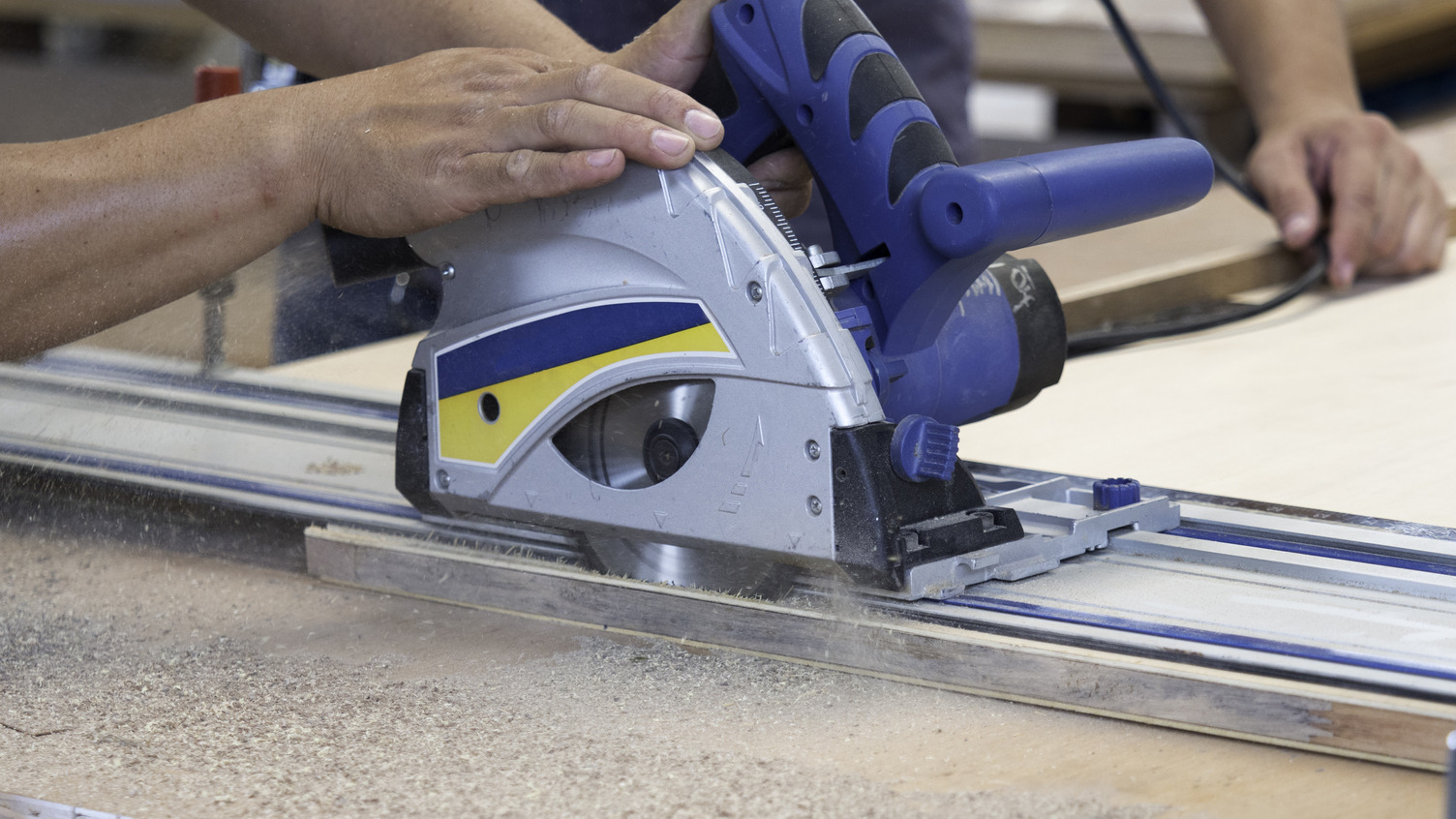 Person using a track saw