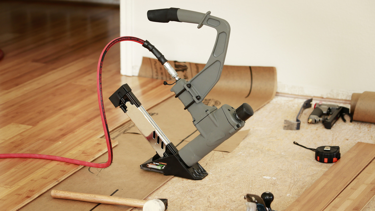 Flooring tools being used for hardwood installation
