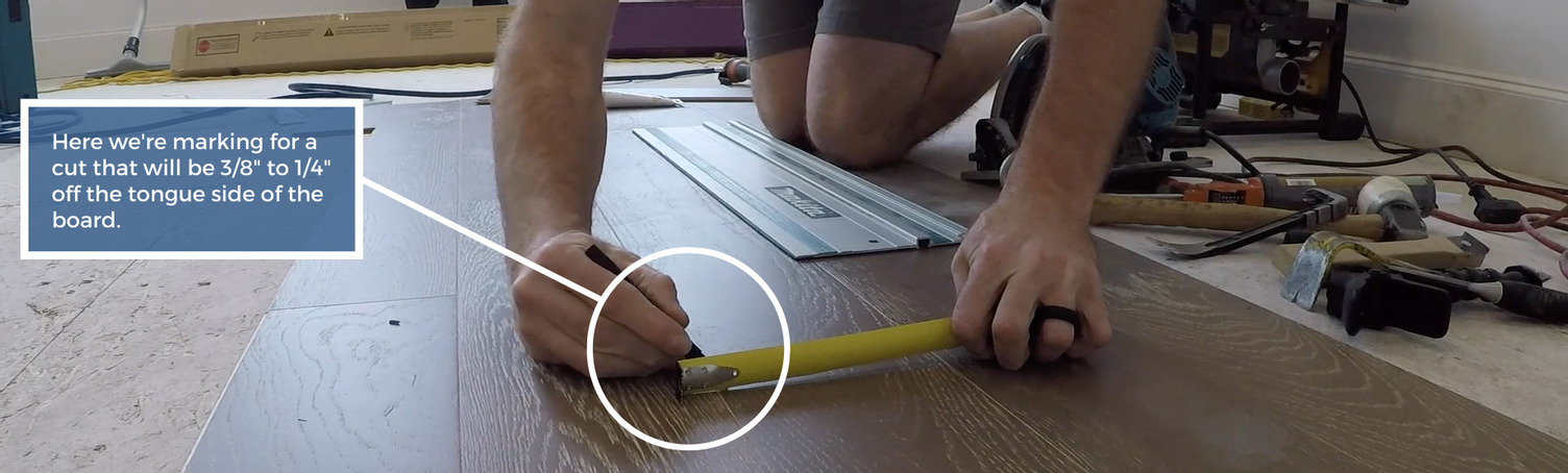 Graphic showing where to mark the first cut in replacing a board in a floor