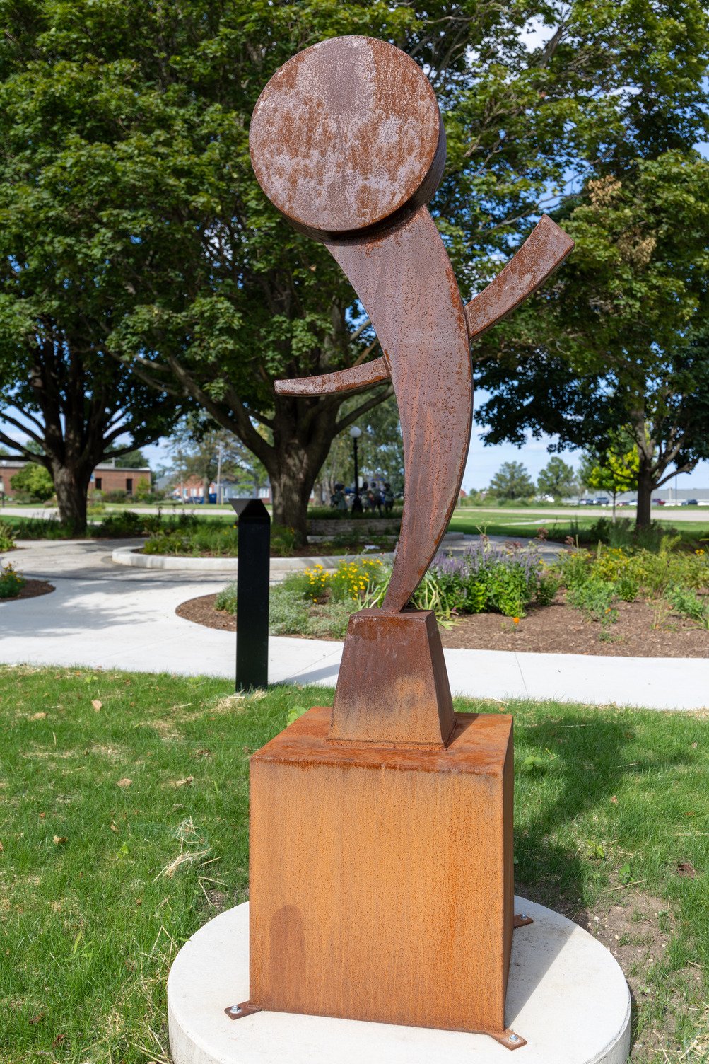 6’ tall carbon steel sculpture on a 3’ base, the gleeful piece mimics an enthusiastic person with raised arms